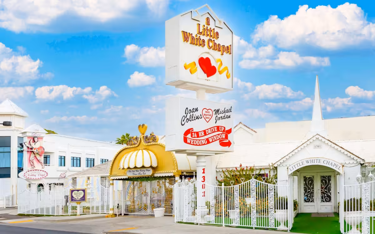 Little White Wedding Chapel Little White Wedding Chapel exterior in Las Vegas with iconic sign, white fence, and wedding venue entrance